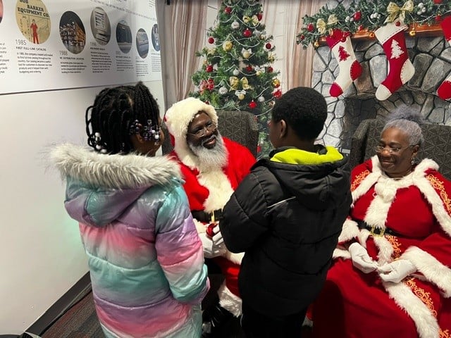 Santa giving gifts at the Angel Tree event